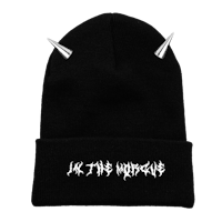 a black beanie with horns on it