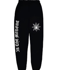 a black sweatpants with an image of a spider on it